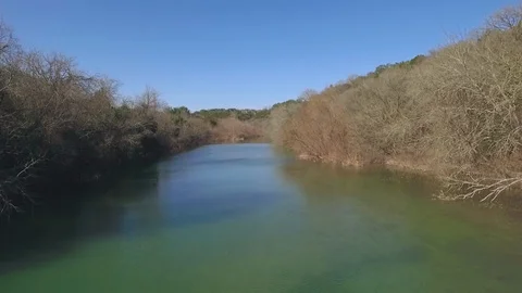 Barton Creek Austin Texas streaming waterfall drone moving backwards over  water Stock Footage 101850810