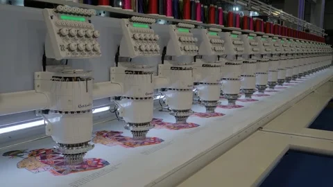 Barudan embroidery machine is creating decorative textile pattern on the fabric Stock Footage 343870510