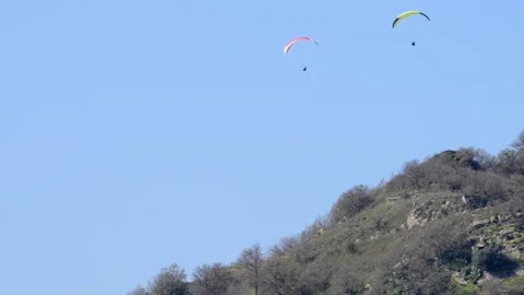 BAS 9156two paragliding pilots Stock Footage 149412987