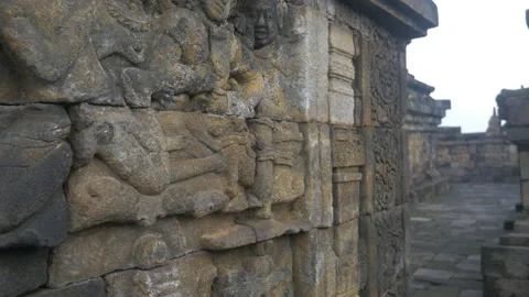 Bas-relief and carved pattern at the Buddhist Borobudur temple, in Indonesia Stock Footage 222771362