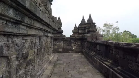 Bas Relief and Stupas on the wall, Borobudur Temple Terrace, Java, Indonesia Stock Footage 306615211