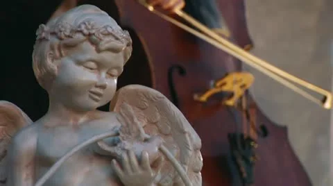 Bas-relief of the angel and playing the cello Stock Footage 12279503
