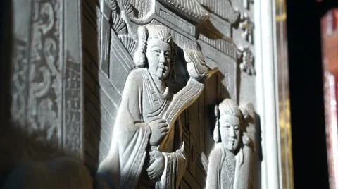 Bas relief art work with sun light in Chinese temple. Religious art details Video stock 61154661