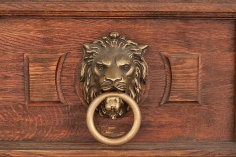 Bas-relief of a lion's head with a ring in its mouth Stock Photos