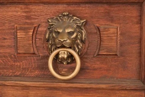 Bas-relief of a lion's head with a ring in its mouth Stock Photos