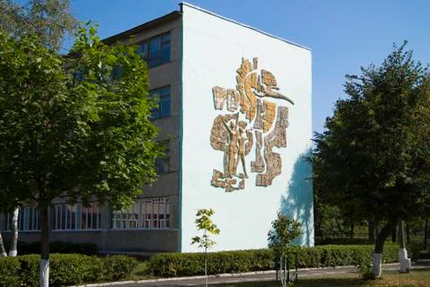 The bas-relief of the Soviet Union on the wall of the gymnasium Stock Photos