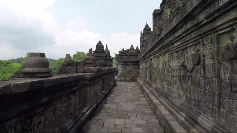 Bas Relief on the wall, Buddha Statue, Borobudur Temple Terrace, Indonesia 库存影片 309293860