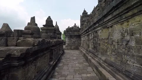 Bas Relief on the wall, Buddha Statue, Borobudur Temple Terrace, Indonesia Stock Footage 309294995