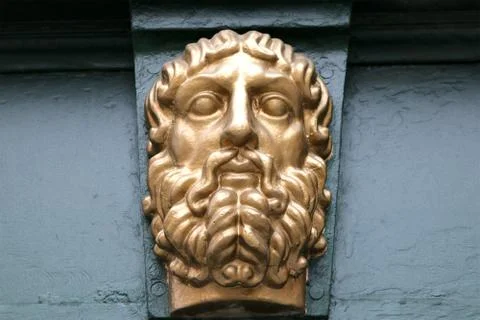 The bas-relief on the wall man face Stock Photos