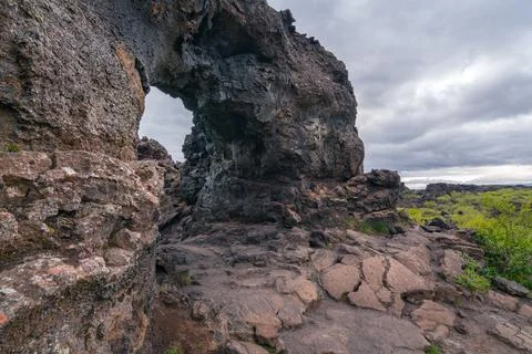 Basalt arch in the Dimmu Borgir area of northern Iceland. Cold and cloudy day in Stock Photos