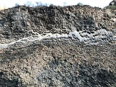 Basalt column cave in Armenia, background, wall, rock, stone, geology, volcanic Stock-Fotos