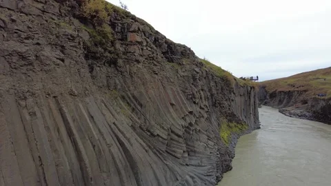 Basalt Column Formations at Studlagil Canyon Iceland River Stock Footage 344171644