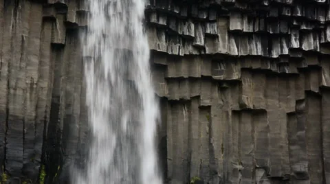 Basalt columns and falling water at Svartifoss, Iceland Stock Footage 33752411