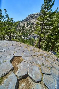 Basalt Columns Pine Trees and Mountain Landscape at Devils Postpile California Stock Photos