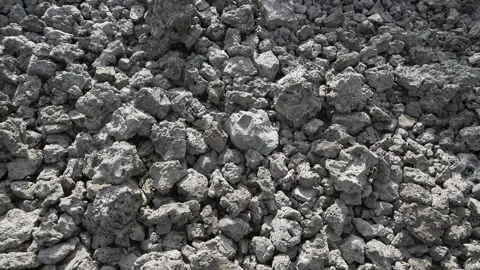 Basalt lava plain with porous volcanic rocks and sparse - Igneous Rock and Moss Stock Footage 339402955