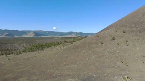 Basalt plain plus lava tuff hill - Volcanic Terrain and Geological Formation Stock-Footage 339706399