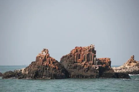 Basalt Rock Formation in the Ocean Stock Photos