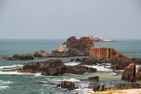 Basalt Rock Formation in the Ocean Stock Photos