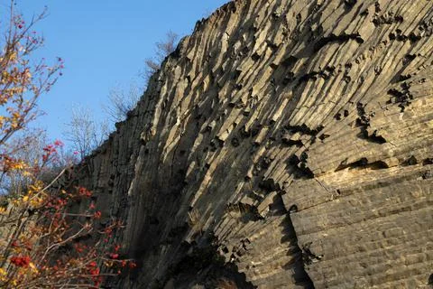 Basalt rock formation in sunlight Stock Photos