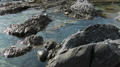 Basalt rock formations on the shore of Rhodes Stock Footage 32303832