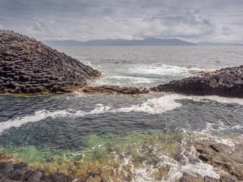 Basalt rock at the isle of Staffa, Inner hebrides, Scotland, UK Stock Photos