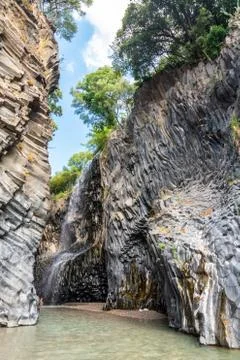 Basalt rocks and pristine water of Alcantara gorges in Sicily, Italy Stock Photos
