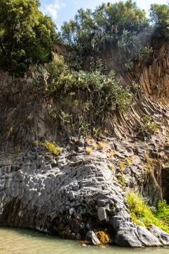 Basalt rocks and pristine water of Alcantara gorges in Sicily, Italy Stock Photos