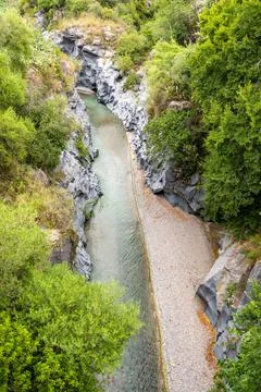 Basalt rocks and pristine water of Alcantara gorges in Sicily, Italy Stock Photos