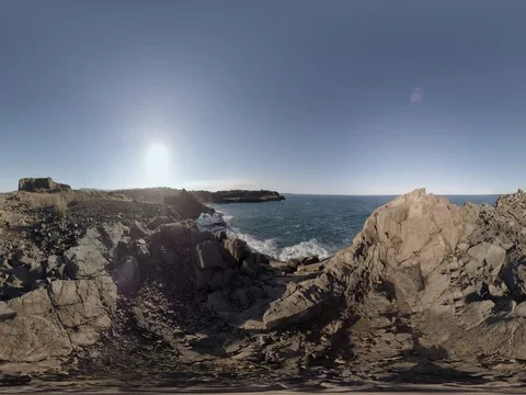 Basalt sea cliff overlooking waves crashing on rock shelf 360 Sitting height Stock Footage 80360351