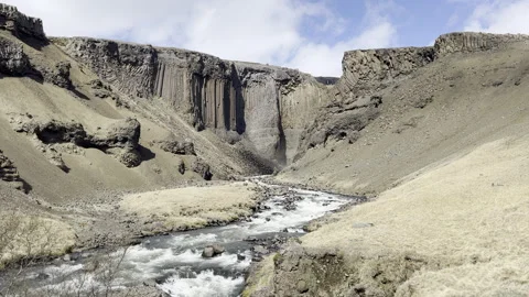 Basalt volcanic rock formations and river flowing in iceland water 4k hdr Stock Footage 279337383