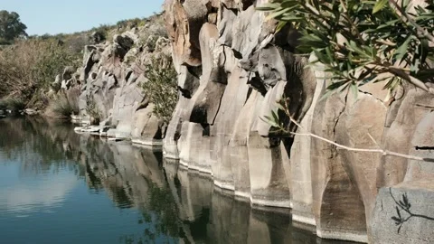 A basalt wall formation of a water pool. 4K Stock Footage 159755605