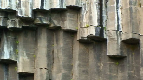 Basaltic rock columns, hexagonal shape, pan left Stock Footage 38020502