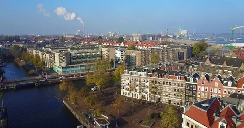 Bascule bridge over a canal with port cranes beyond Vídeo Stock 71294514