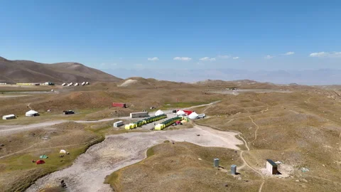 Base camp at the foot of Lenin Peak with snow-covered mountains. Stock Footage 321397931