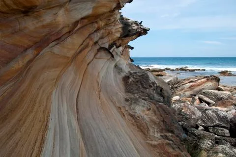 Base of cliff at Marley beach looking out to sea Stock Photos