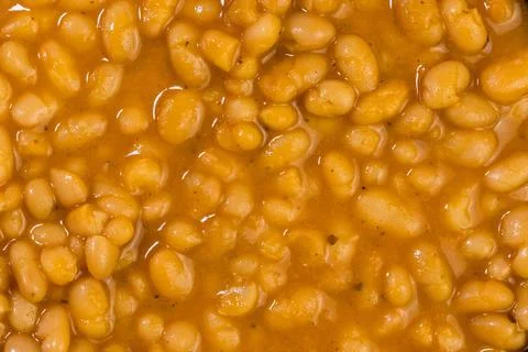 Base of cooked white beans in sauce Stock Photos
