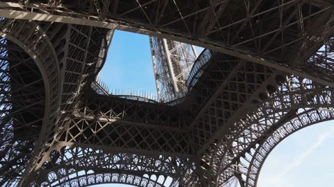 The base of the Eiffel Tower in Paris. View of the Eiffel Tower from below with Stock Footage 282209280