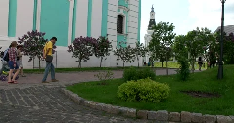 The base five-tiered bell tower, blooming lilacs, the territory of the monastery Stock Footage 67697747
