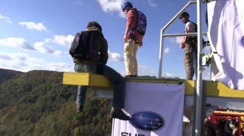 Base jumper jumps from platform and free falls before deploying parachute Video stock 8850848
