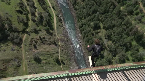 Base Jumper Launches from Bridge Stock Footage 54643962