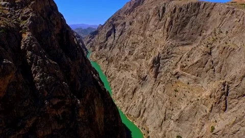 Base Jumper Leaping Over River Canyon Stock Footage 309483618
