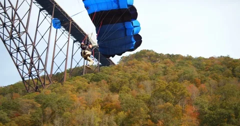 Base Jumper With Parachute, Slow Motion, Forest Landscape Stock Footage 127467596