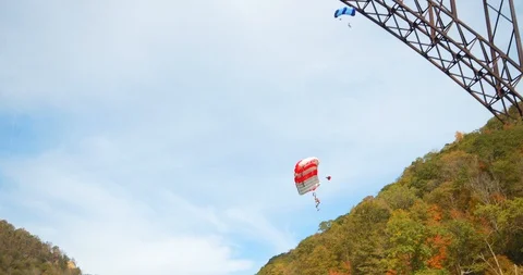 Base Jumper With Parachute, Slow Motion Through Sky, Forest Stock Footage 127467786