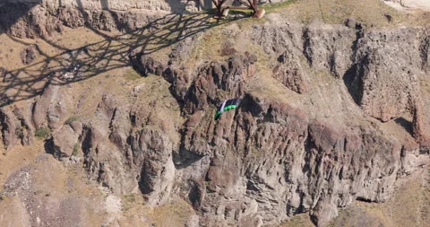 Base jumper parachutes from the Perrine Bridge Stock Footage 215320300