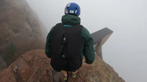 BASE Jumping Into Low-Lying Clouds, Apache Junction, Arizona, USA - 23 Dec 2023 Stock Footage 259919160