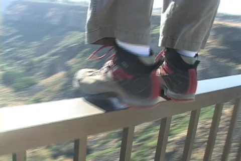 Base Jumping of the Perrine Bridge in Twin Falls, Idaho, From behind, Wide Shot Stock Footage 85326