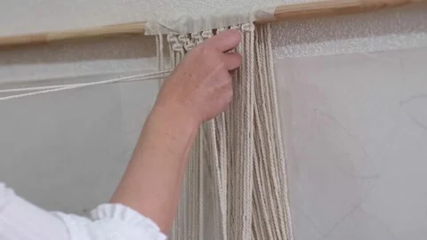 The base knots of macrame, the view from behind the shoulder close-up of the Stock Footage 159533822