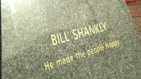 Base plinth of Bill Shankly statue outside Liverpool Football Club, Anfield 動画素材 124608364