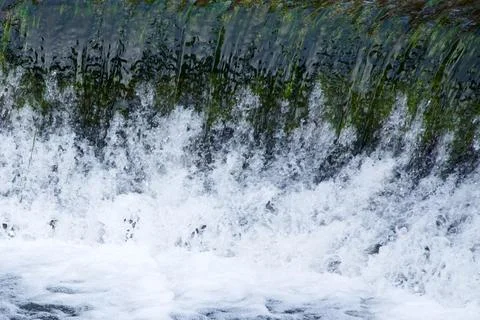The Base of A Small, Straight Waterfall Stock Photos
