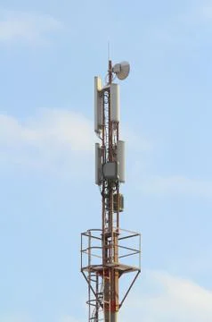 Base station mobile network antenna on a steel structure mast with a repeater Stock Photos